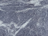 Dark grey, with white veinings 